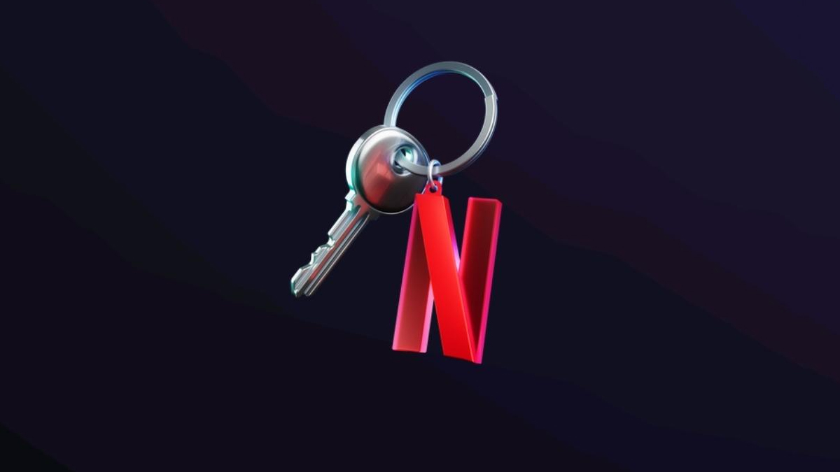 Key with a red Netflix logo tag hanging from a silver keyring on a dark background